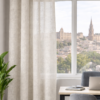 Cortinas confeccionadas Delhi de Fundeco en tejido claro con textura natural, caída elegante y acabado con ollados metálicos, ideales para vestir cualquier estancia con luz y estilo.
