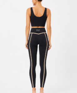 Legging deportivo Selmark ST775 verde con cintura alta, bolsillo lateral y detalles en contraste combinado con top deportivo a juego sobre fondo blanco.